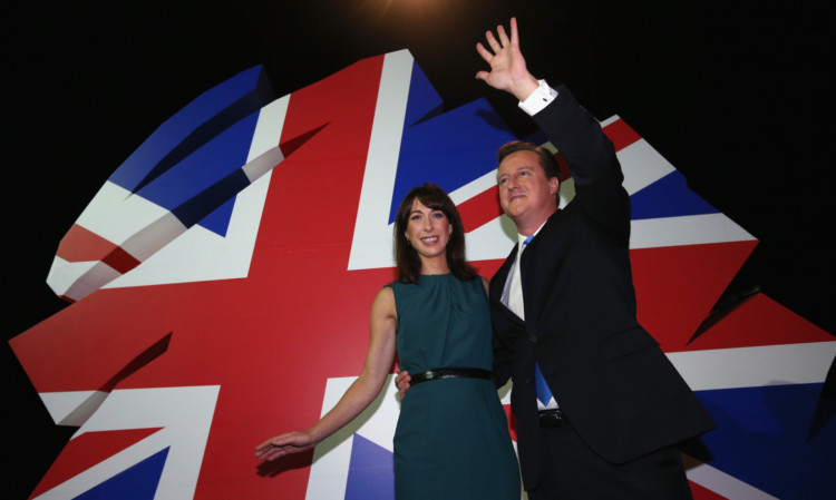 David Cameron and wife Samantha thank the crowd after his speech.