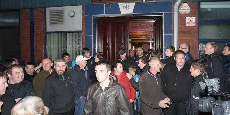 Kris Miller, Courier, 06/10/10, News. Picture today at Dens Park, Dundee. A demonstration was arranged outside the staium tonight but turned into a meeting with fans being invited into the stadium for talks. Pic shows worried fans leaving the stadium apparently no nearer finding out where the future of their club lies.