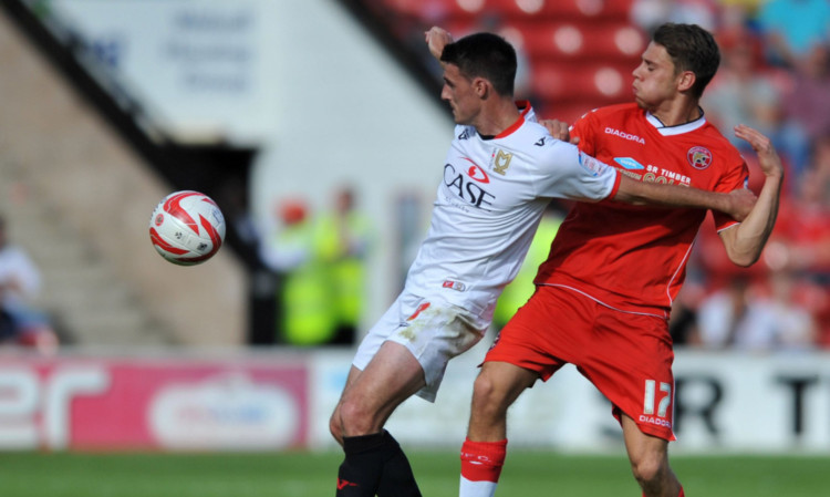 George Bowerman, right, in action for Wallsall against MK Dons.