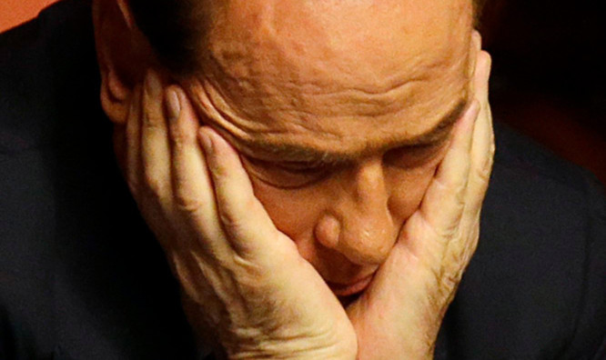 A clearly dejected Silvio Berlusconi, left, after Prime Minister Enrico Letta easily won the confidence vote in the Italian Senate.