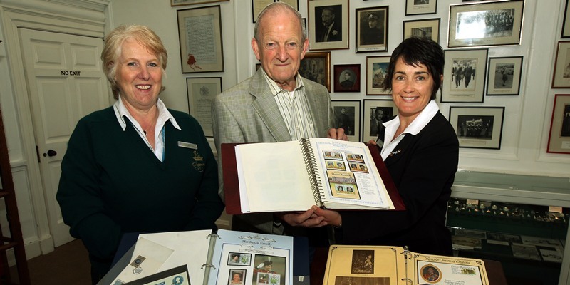 John Stevenson, Courier,06/10/10.Angus,Glamis Castle donation of royal stamp collection to castle.Pic shows l/r  castle guide Vicka Carle,Dick Frost who donated his private collection and Glamis Castle marketing manager Libby Reynolds with a small selection of the albums.