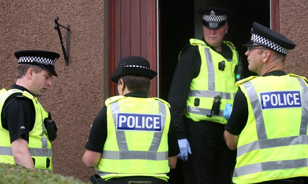 Kris Miller, Courier, 02/10/13. Arbroath drugs raid. Pic shows officers outside the property in Helen Street.