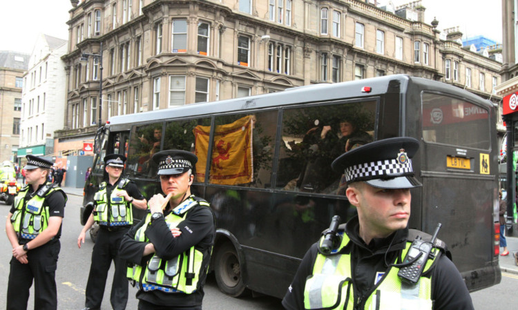 Police watch on during a previous Dundee Together rally in City Square clashed with Scottish Defence League rally. The SDL were bussed away from Dundee.