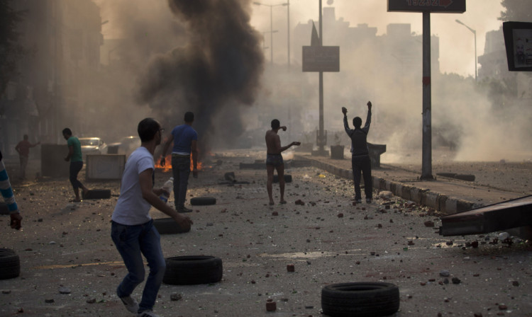 Supporters and opponents of Egypt's ousted Islamist President Mohammed Morsi clash in Cairo.