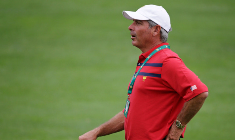 Fred Couples watches the action.