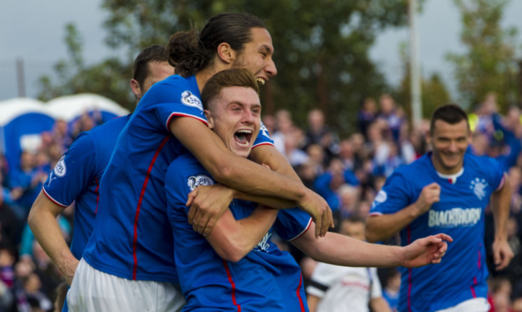 Lewis Macleod is congratulated by Bilel Mohsni after doubling Rangers' lead with an overhead kick.