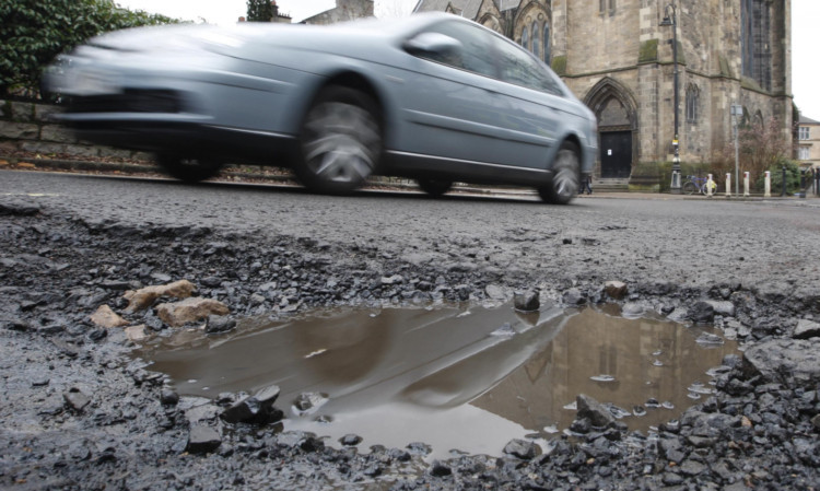 Britains potholes now collectively measure 295sq m   twice the size of the Isle of Wight.