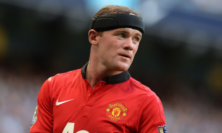 Wayne Rooney was approached by Berti Vogts about playing for Scotland.