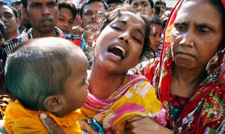 Grieving relatives of garment workers caught up in the factory fire.