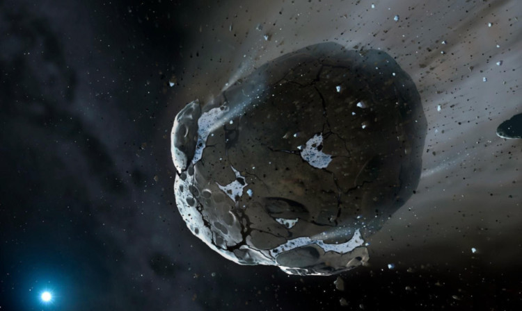 An artists impression issued by Cambridge University of the shattered remains of an asteroid which contained huge amounts of water and orbited an exhausted star.