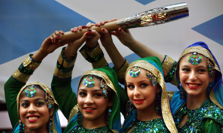 The baton is sent on its way from Glasgow Airport by the Desi Braveheart dancers.