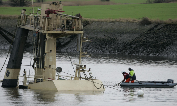 The salvage operation for the capsized Flying Phantom tug on the River Clyde.