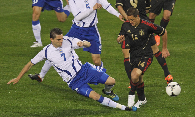 Sanel Jahic (left) in action for Bosnia-Herzegovina against Mexico.