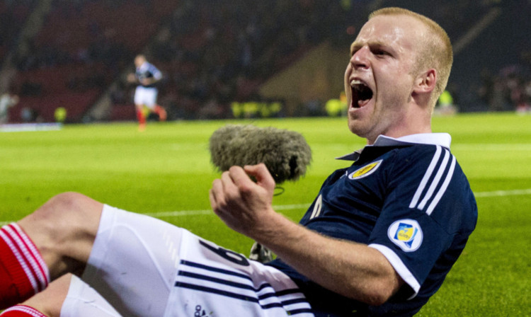 Steven Naismith celebrates the second goal for Scotland.