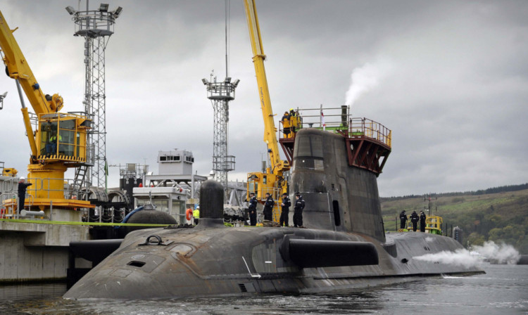 HMS Astute at sea and HMS Ambush berthing alongside Valiant Jetty for the first time.