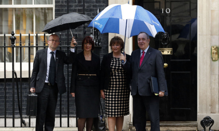 Alex Salmond, right, and the Scottish Government delegation arrive at 10 Downing Street.