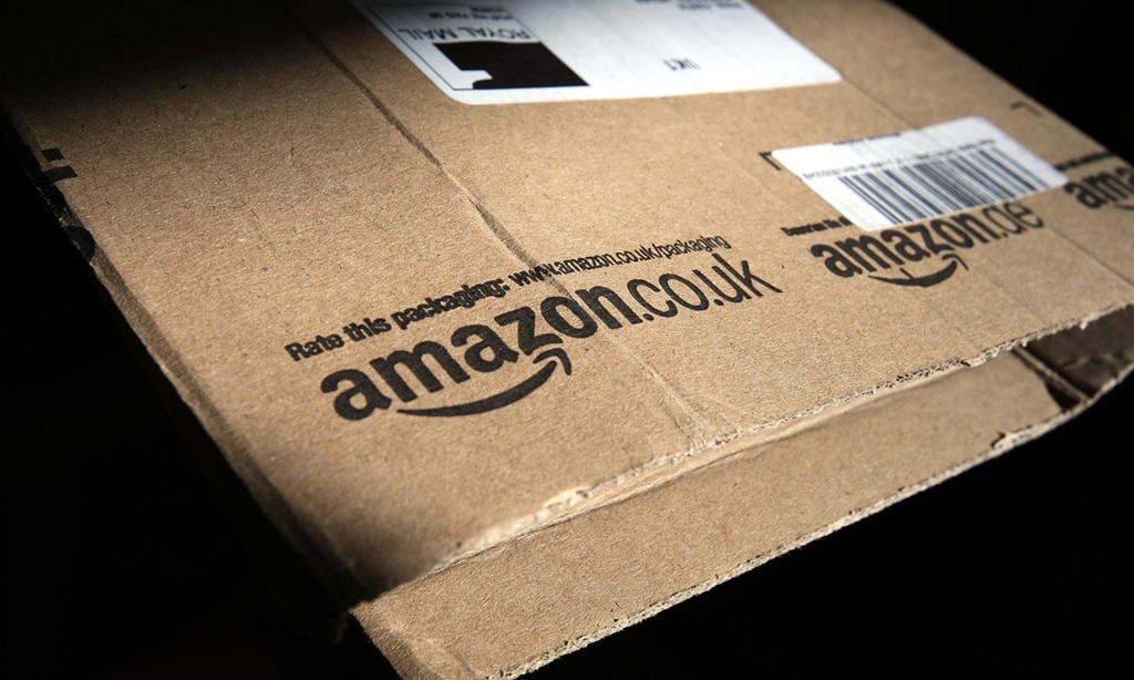 File photo dated 26/04/13 of the Amazon logo on a package. The online retail giant is to create 800 jobs before the end of the year as it gears up for the busy festive season. PRESS ASSOCIATION Photo. Issue date: Tuesday October 15, 2013. The company also announced changes to shift patterns at its distribution centres, moving from five-day eight-hour shifts to four-day 10-hour shifts. The move will give workers three days off every week. See PA story INDUSTRY Amazon. Photo credit should read: Paul Faith/PA Wire