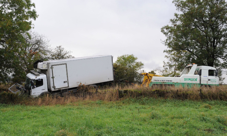 The aftermath of the accident where a lorry left the M90 and ended up in a field near Kinross.