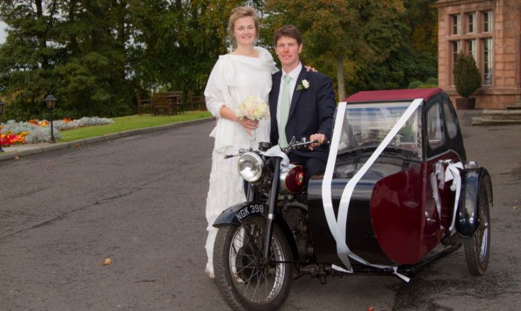 Laura Williams and new husband Ben with her unusual mode of wedding transport.