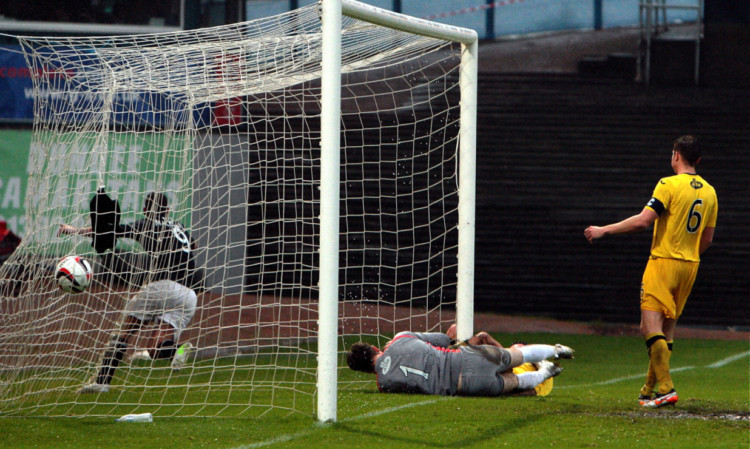 Peter MacDonald ends up in the back of the net as he scores Dundee's opener.