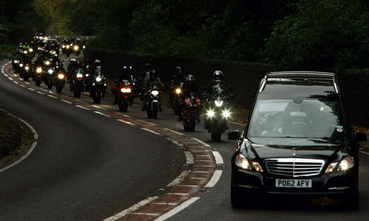 The convoy of bikers following the hearse.