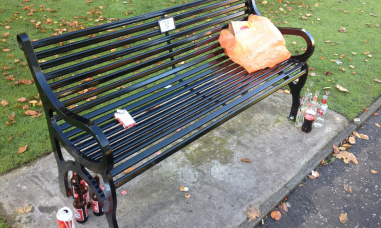 Litter left around the bench in the Memorial Gardens.