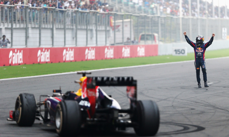 Sebastian Vettel celebrates in front of the crowd on the main straight following the Indian Grand Prix.