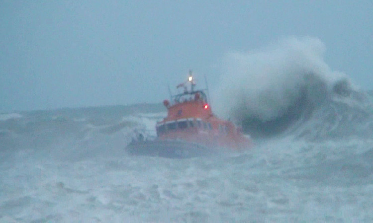 Lifeboat crew brave treacherous conditions to search for a teenager swept out to sea at West Beach, Newhaven.