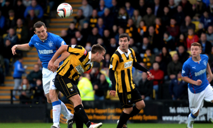 Rangers hat-trick hero Jon Daly gets above his marker to head home his second goal of the game.