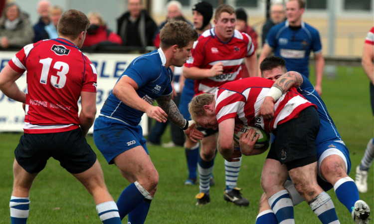 A Howe of Fife drive is slowed by a tackle during the win over Jedforest.