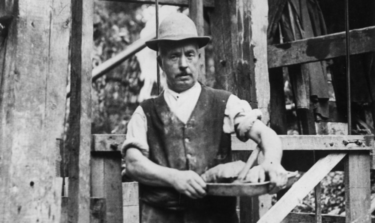 A worker at a gold mine circa 1930.