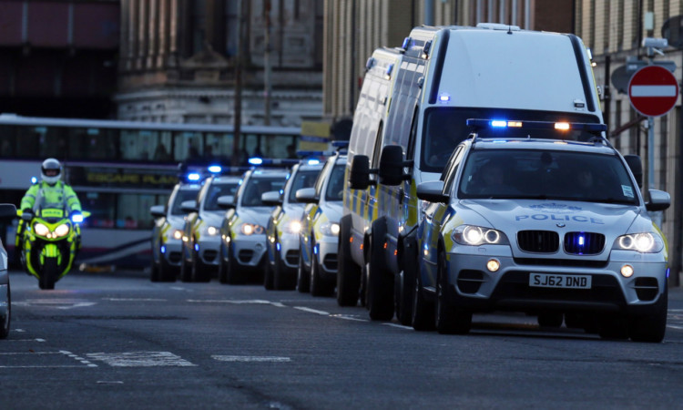 The five people charged with terrorism offences are transported to Glasgow Sheriff Court.
