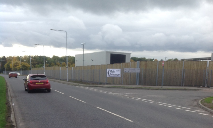 The wooden fence sits behind a wire fence and the outlay has been described as outrageous.