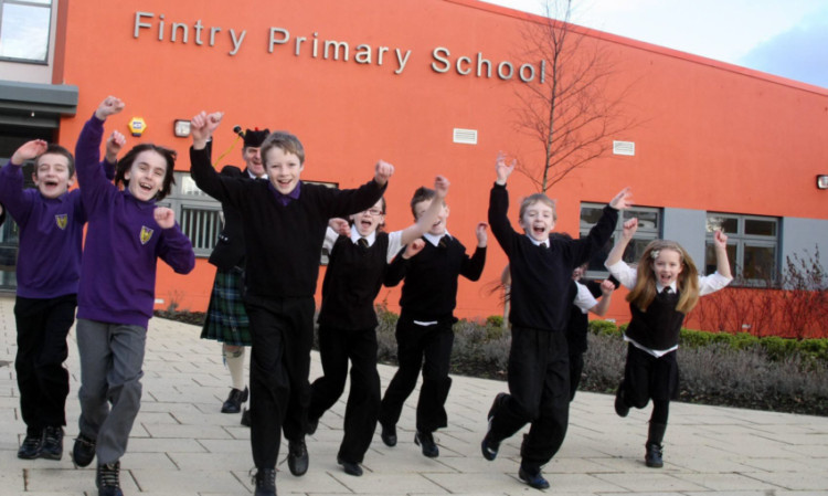 Pupils celebrate the opening of Fintry Primary School. Construction group Robertson has sold its stake in a large portfolio of public-private partnership projects, including dozens of schools and a string of hospitals across Scotland.