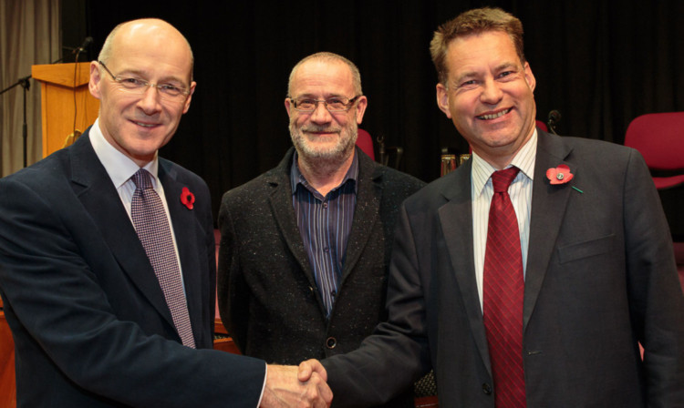 John Swinney (left) and Murdo Fraser (right) with debate chairman Peter Southcott.