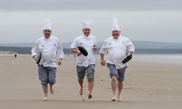 Pans people: executive chefs Martin Hollis, Old Course Hotel, Alan Matthew, Fairmont St Andrews, and Ian MacDonald, St Andrews Links, get up to speed on the beach.