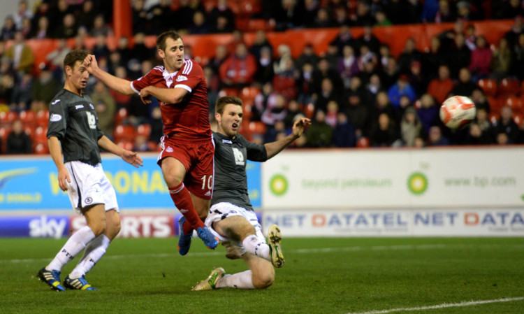 Aberdeen goal machine Niall McGinn fires home his second of the game.