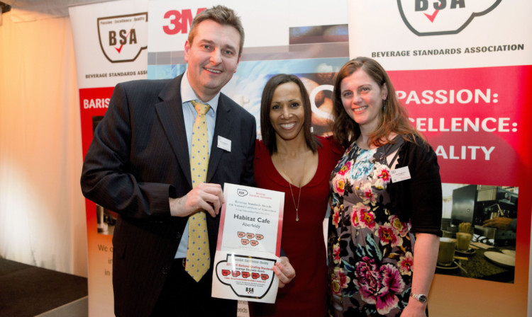 Mike Haggerton and his wife Jan are presented with the award by Dame Kelly Holmes.