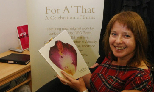 Artist Brigid Collins with the Burns anthology For A That, part of the DUP backlist.