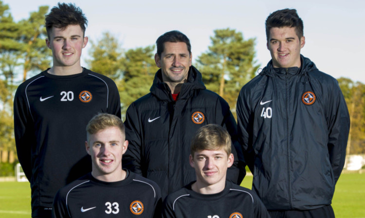 Jackie McNamara is in good spirits after securing contract extensions with John Souttar (back left), Darren Petrie (back right), Euan Spark (front left) and Ryan Gauld.