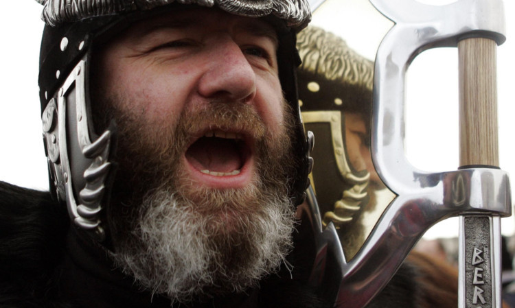 Alistair Carmichael marching through the streets of Lerwick, Shetland, during the Up Helly Aa festival.