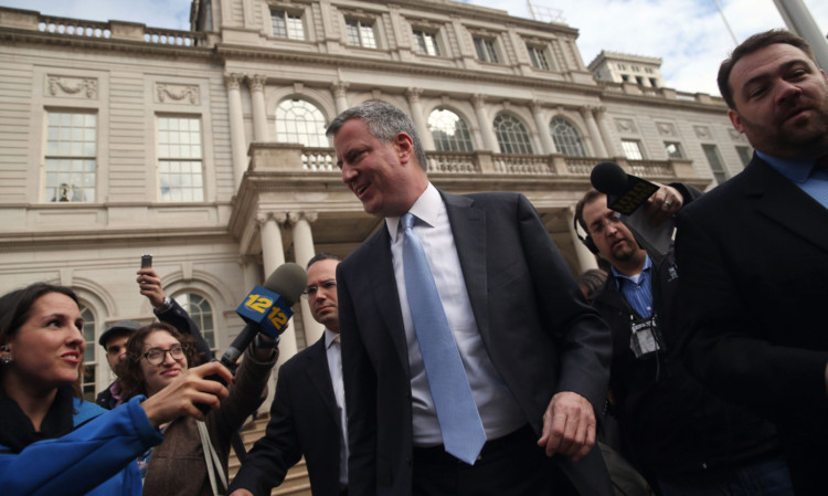 Bill de Blasio leaves City Hall after meeting outgoing mayor Michael Bloomberg.