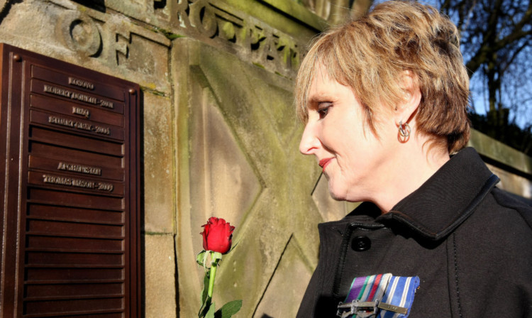 Linda looking at her son's name on Dunfermline War Memorial.