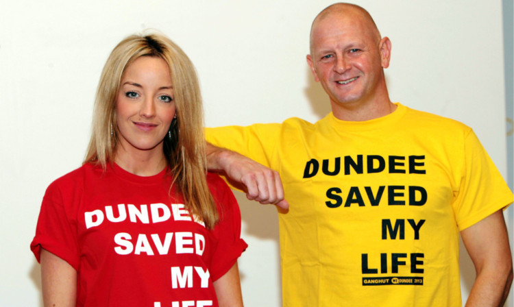 Hayley Scanlan and Gary Robertson wear the T-shirts loud and proud.