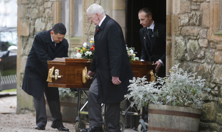 Jack Alexander's coffin is carried from the Auld Kirk in Ayr.