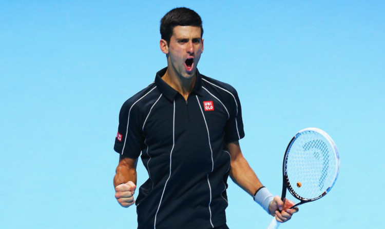 Novak Djokovic celebrates victory over Stanislas Wawrinka.