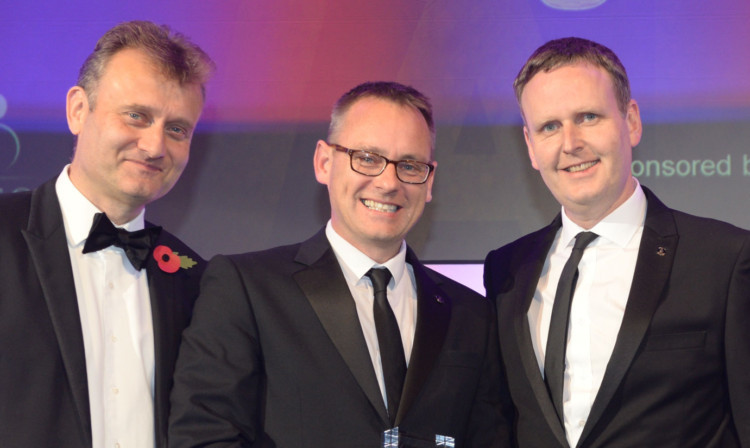 From left: comedian Hugh Dennis with Paul Lothian and Jonathan Gibson, co-founders and directors of Verus.