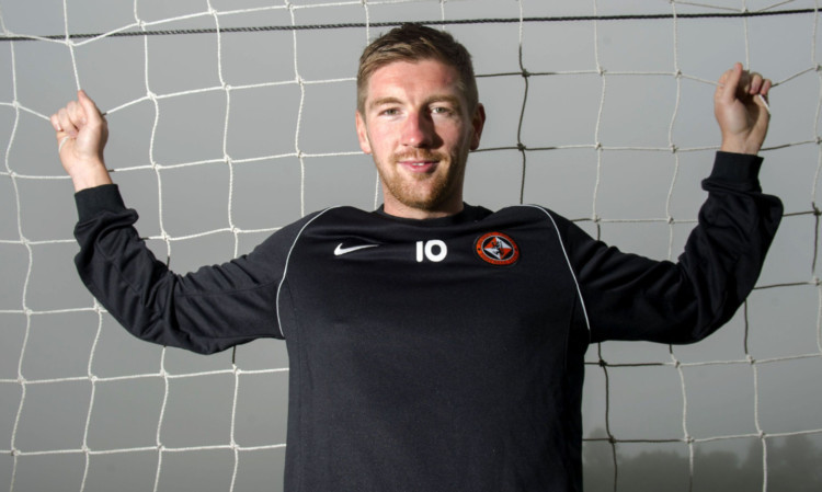 22/08/13
ST ANDREWS
All smiles from Mark Wilson as the defender is unveiled at St Andrews after re-signing for Dundee Utd.