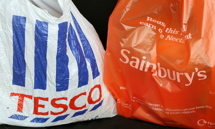 General view of Shopping bags from the two major supermarkets Tesco, and Sainsbury's  in a car boot in Cambridge. PRESS ASSOCIATION Photo. Picture date:Wednesday October 2, 2013. See PA story. Photo credit should read: Chris Radburn/PA Wire