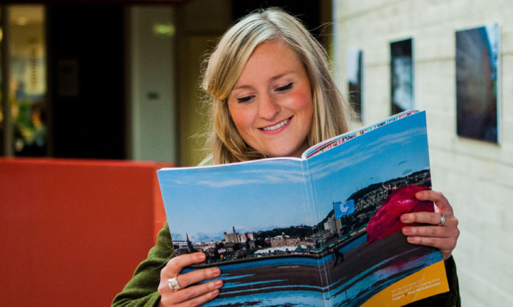 Bid team member Clare Brennan with the document outlining how Dundee would mark being UK City of Culture.